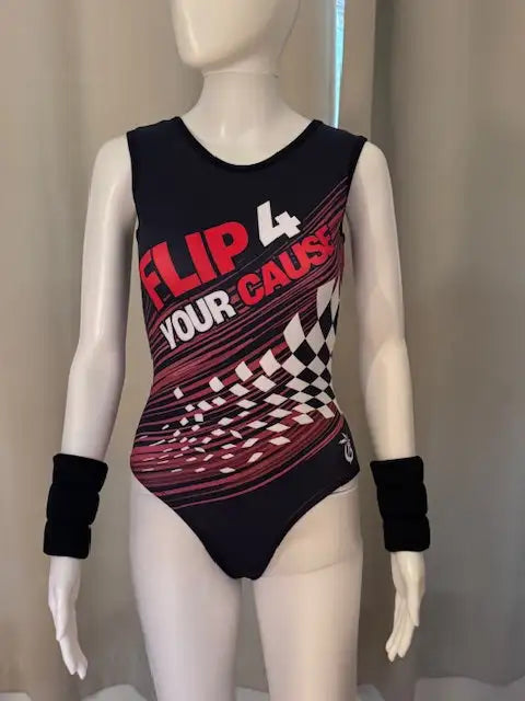 Black sleeveless leotard with bold red and white ’flip 4 your cause’ graphic and checkered pattern, featuring a racerback design.